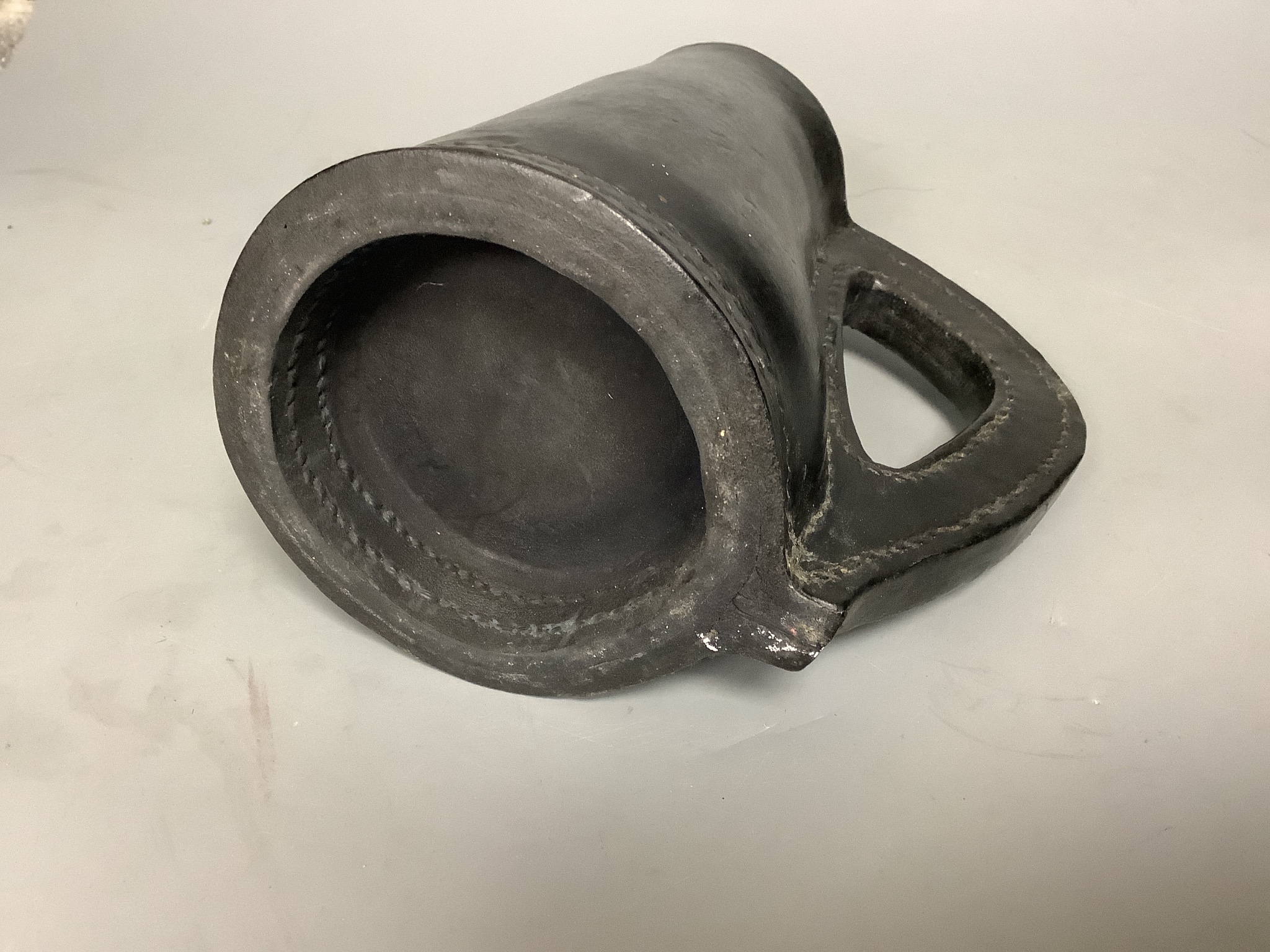 A 19th century leather 'Black Jack' 19cm